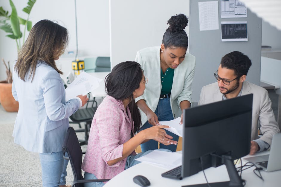 A diverse team engaged in a lively discussion in a modern office setting.