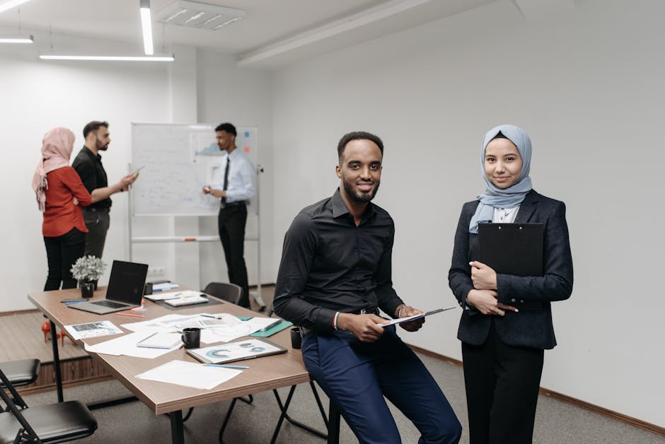 A diverse group of professionals working together in a modern office, focusing on teamwork.